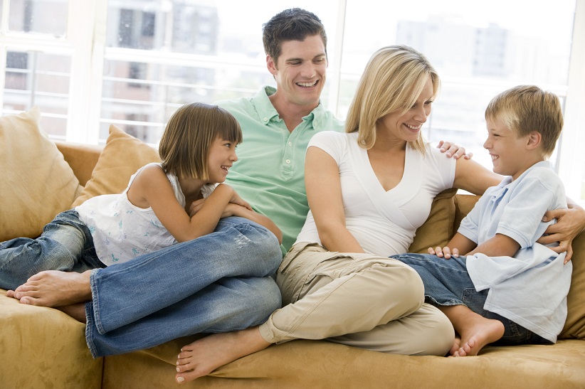 Family sitting on couch