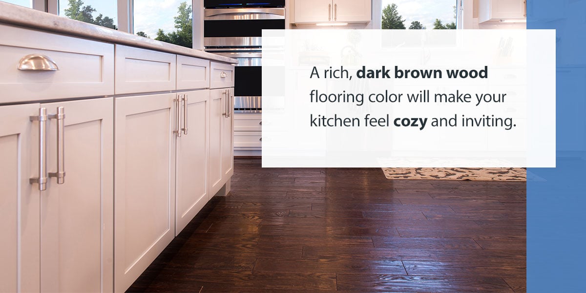 dark brown wood floors with white kitchen cabinets