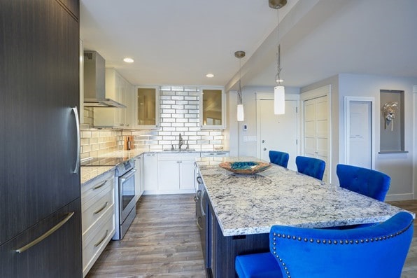 wood floors in kitchen with white cabinets