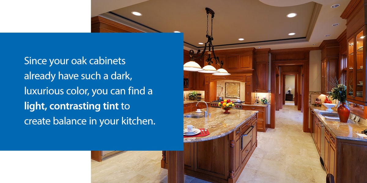 oak cabinets in kitchen with tile floor