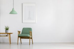 green chair against white wall