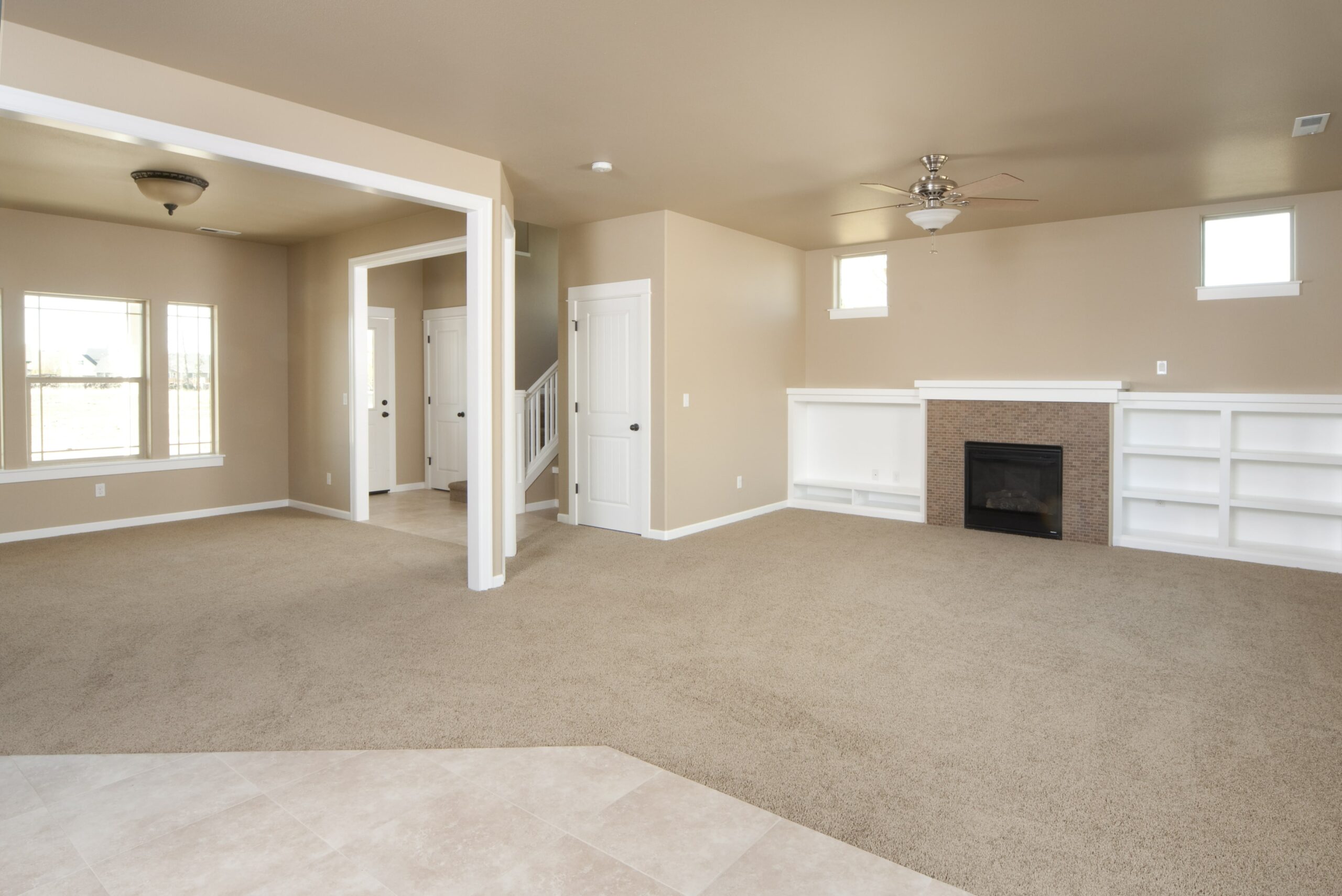 room in home with carpet and tile