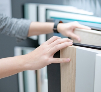 person sorting through flooring samples