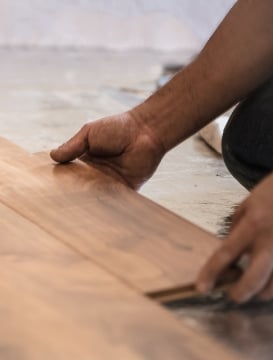 Man installing flooring