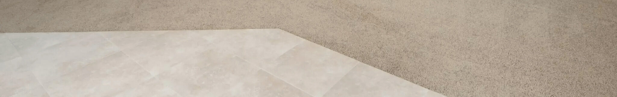 Up-close photo of tile and carpet flooring