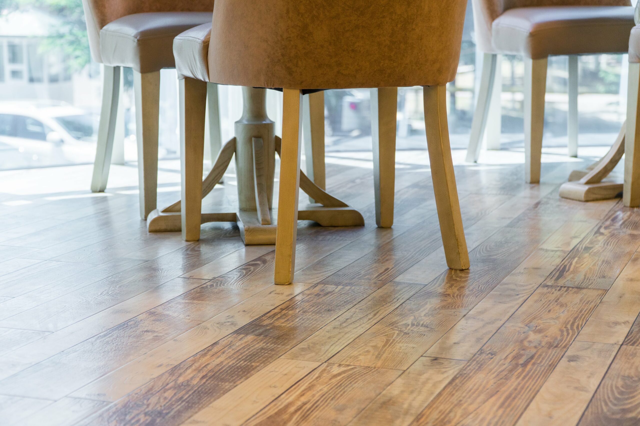 Wood floors under table and chairs