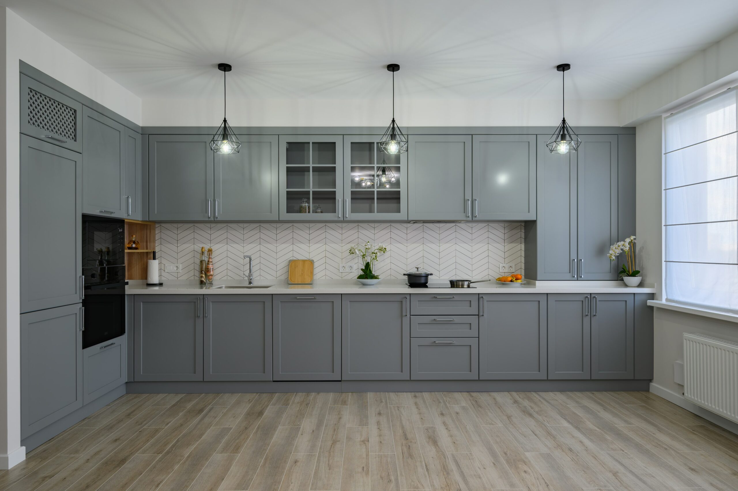 laminate floor in kitchen with gray cabinets