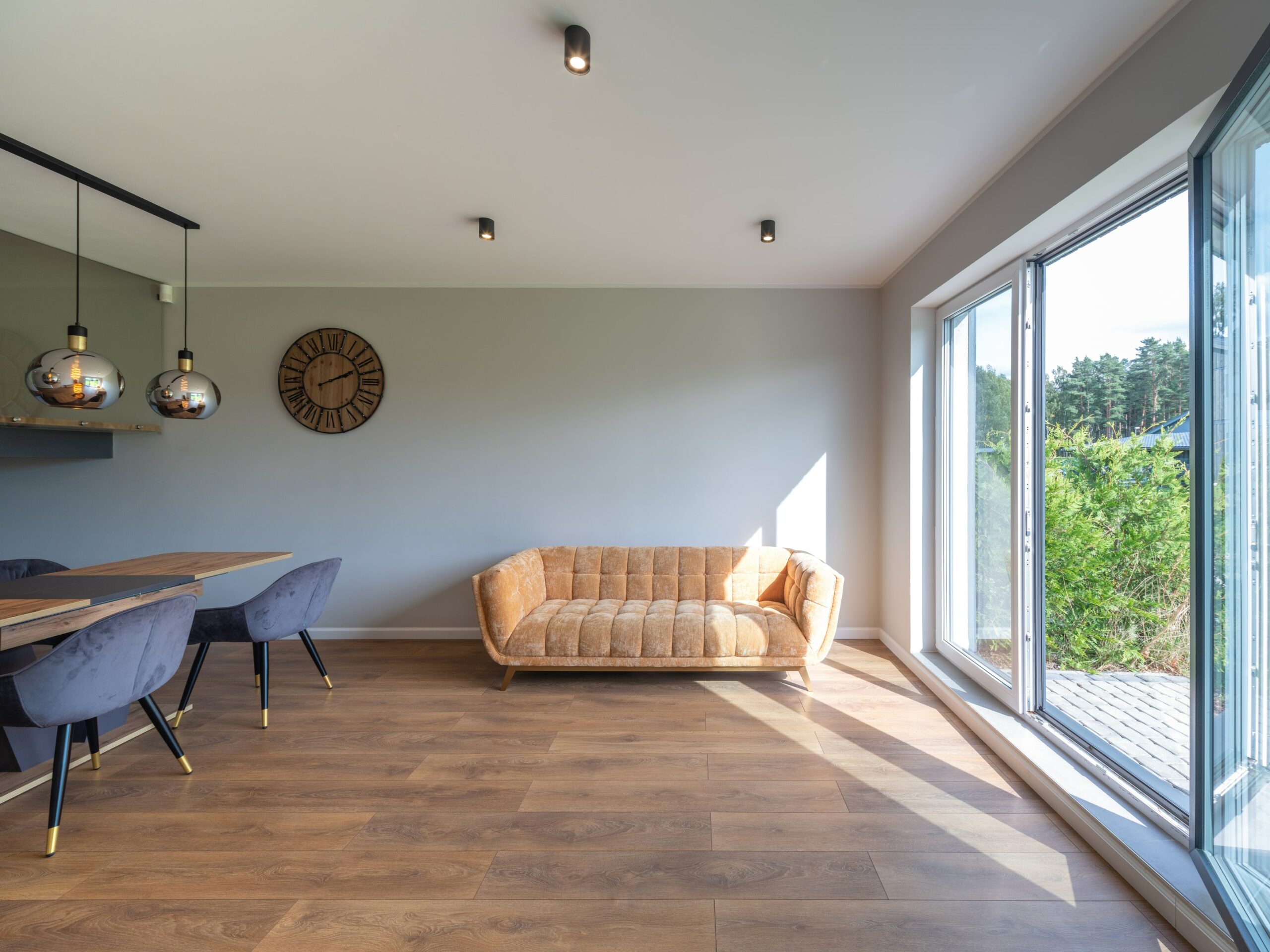 Engineered wood floor in room with couch