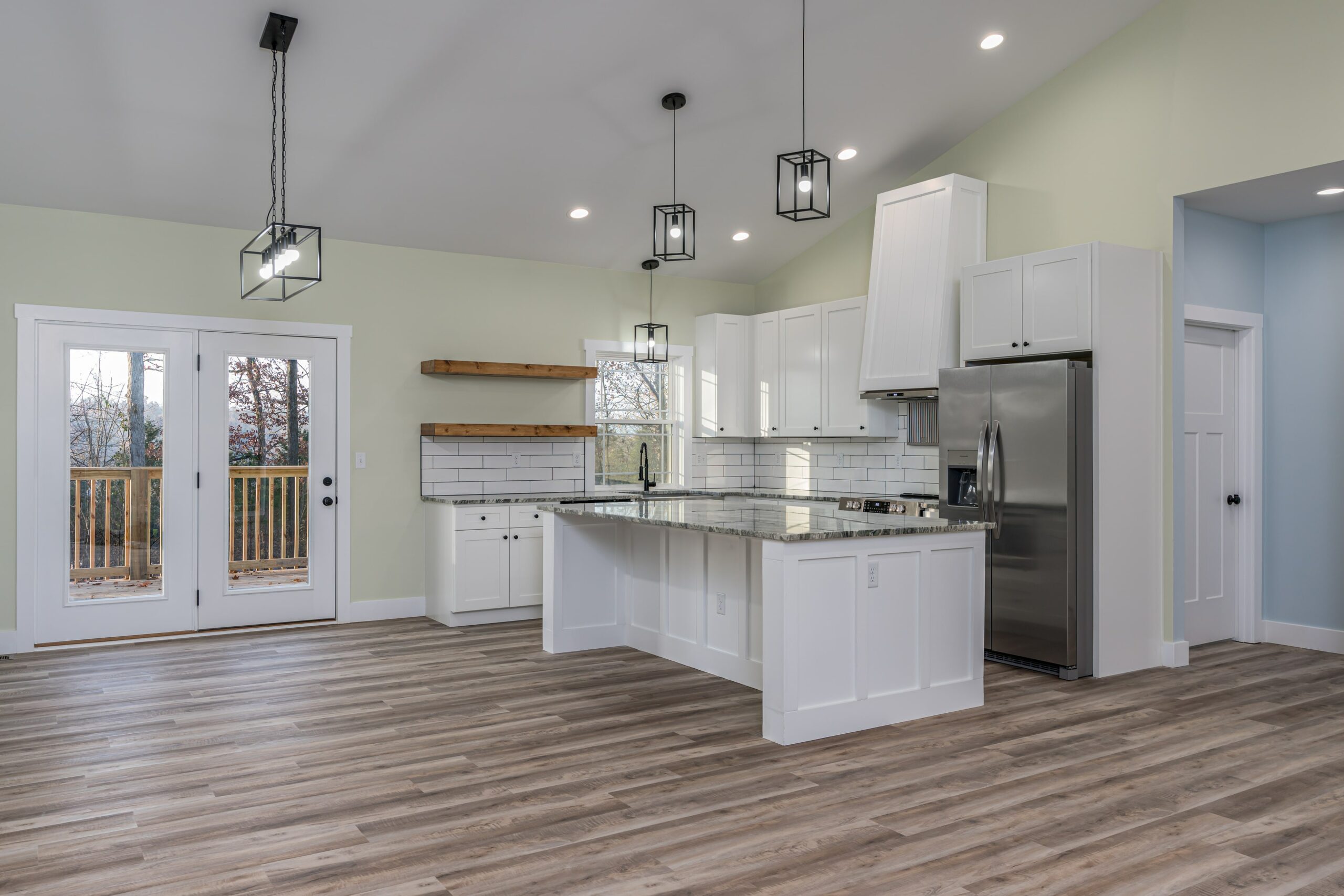 Vinyl flooring in kitchen with white cabinets