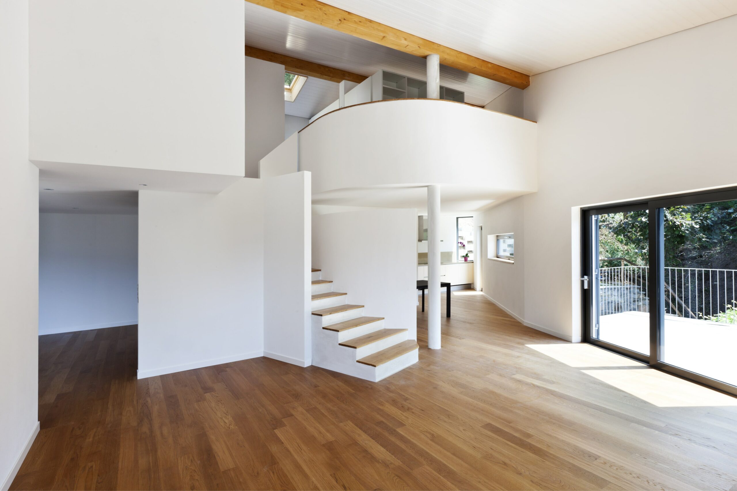 home with wood floors and wood ceiling beams