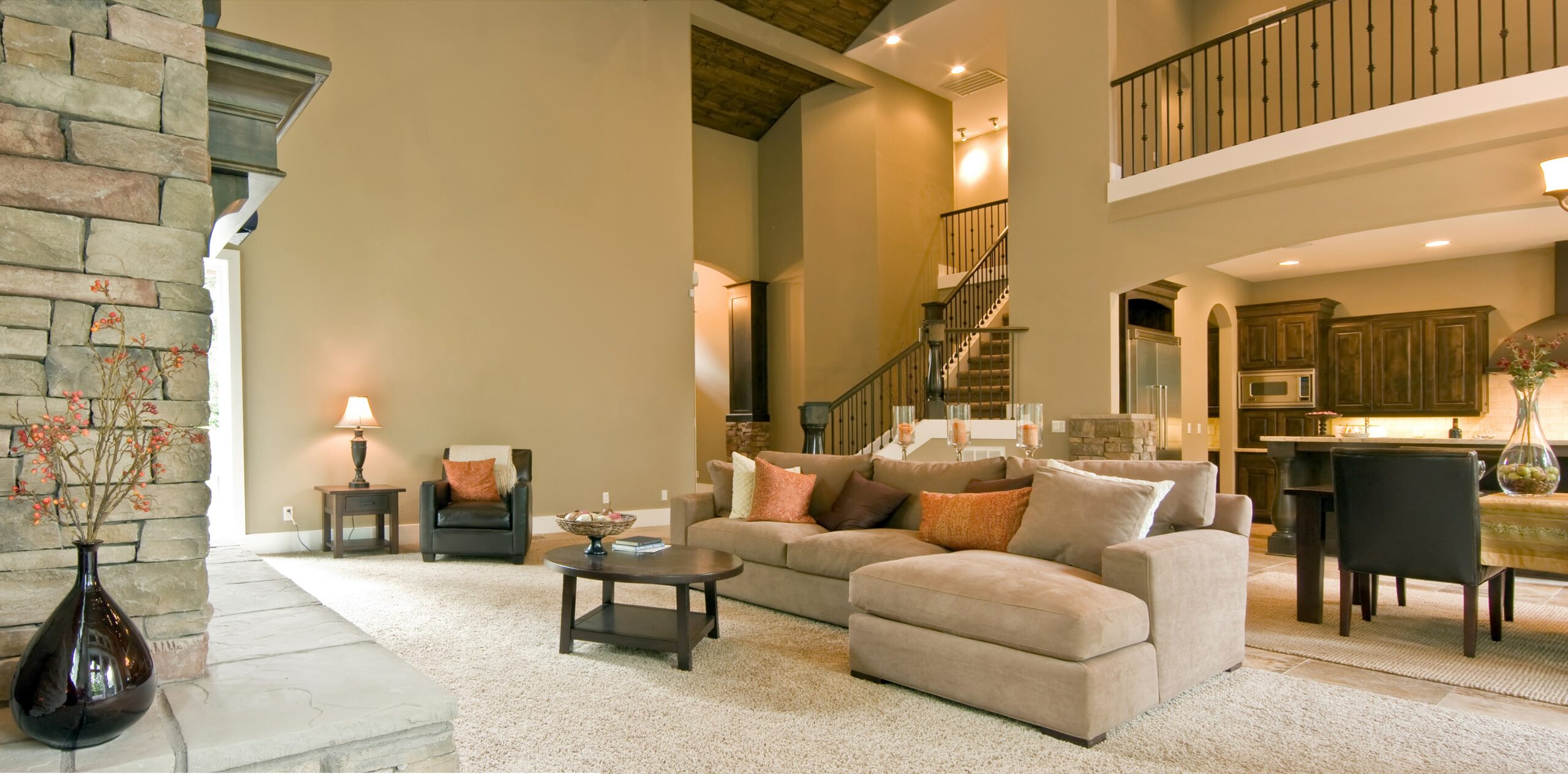 Living room with carpet and kitchen with tile floors