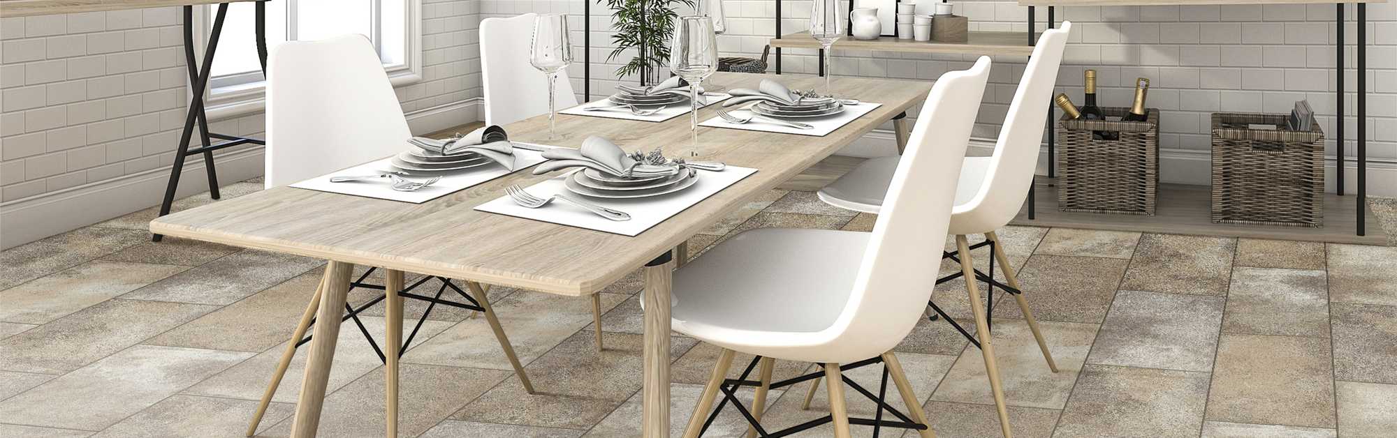 table set with dishes in a room with tile flooring